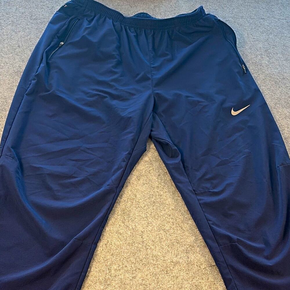 Nike Dri-FIT women Blue Track Pants L Drawstring Pockets Reflective
